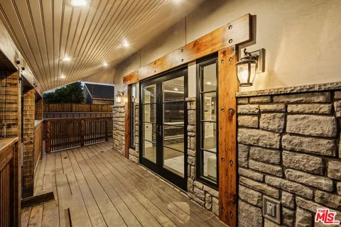 a view of a house with a garage and balcony