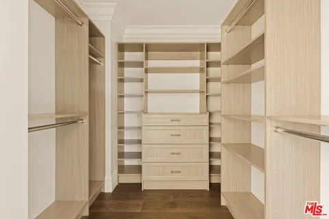 a bathroom with a sink a mirror and a shower