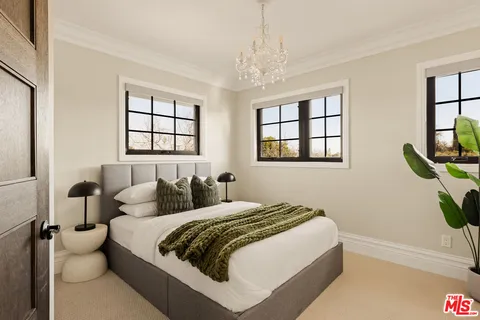 a view of a house with a wooden fence