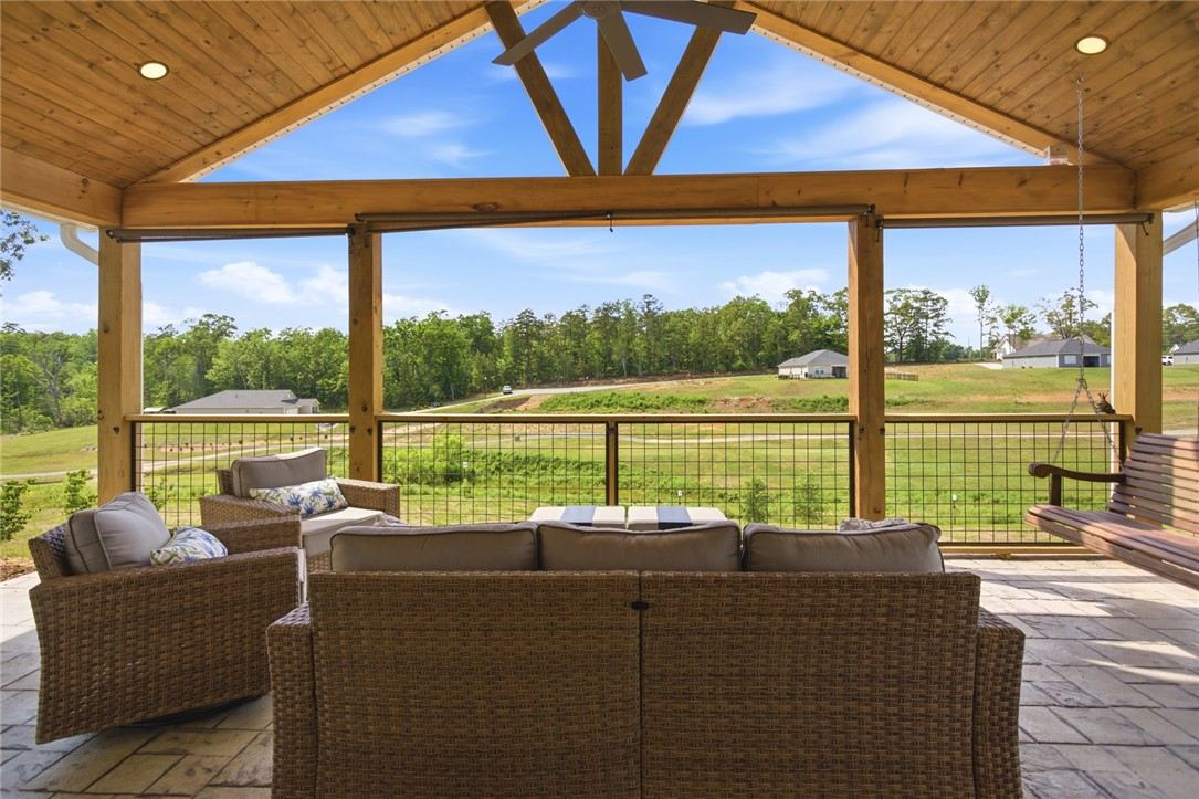 412 Chadwick Lane Walhalla, SC 29691 - Photo 26 of 37 An inviting covered patio offers open-air relaxation with scenic views of verdant hills and distant homes.
