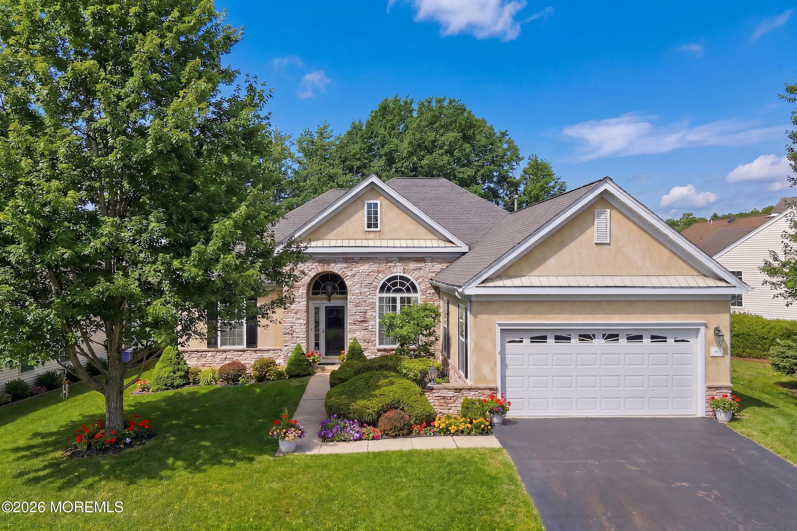 65 Mission Way Barnegat, NJ 08005 - Photo 1 of 51 a front view of a house with a yard and garage
