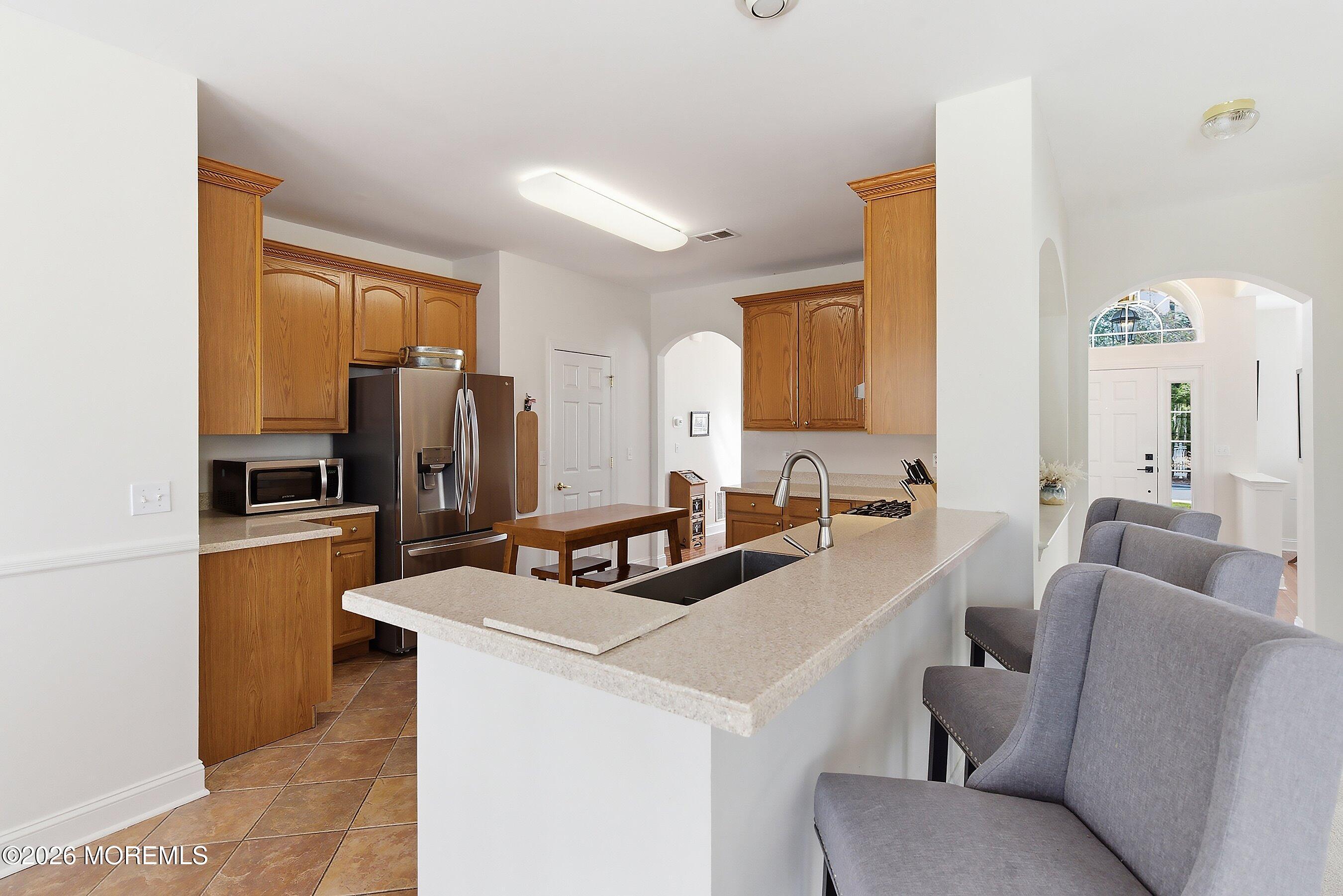 65 Mission Way Barnegat, NJ 08005 - Photo 11 of 51 a living room with stainless steel appliances furniture a refrigerator and a sink