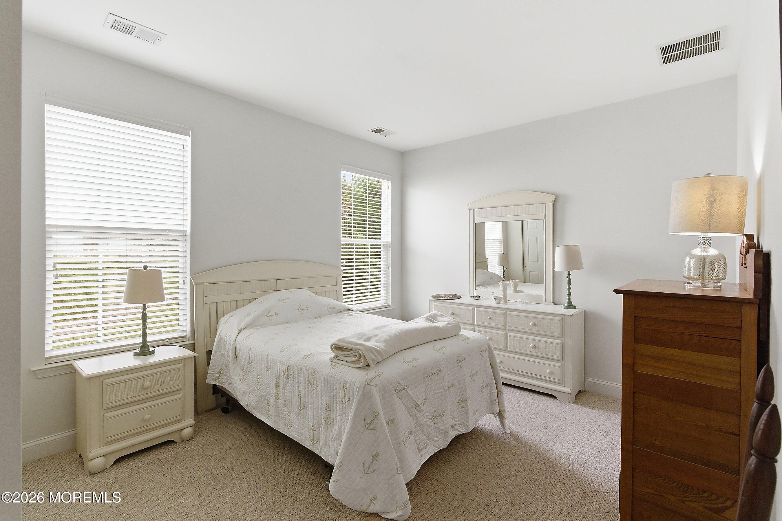 65 Mission Way Barnegat, NJ 08005 - Photo 15 of 51 a bedroom with a bed and a dresser