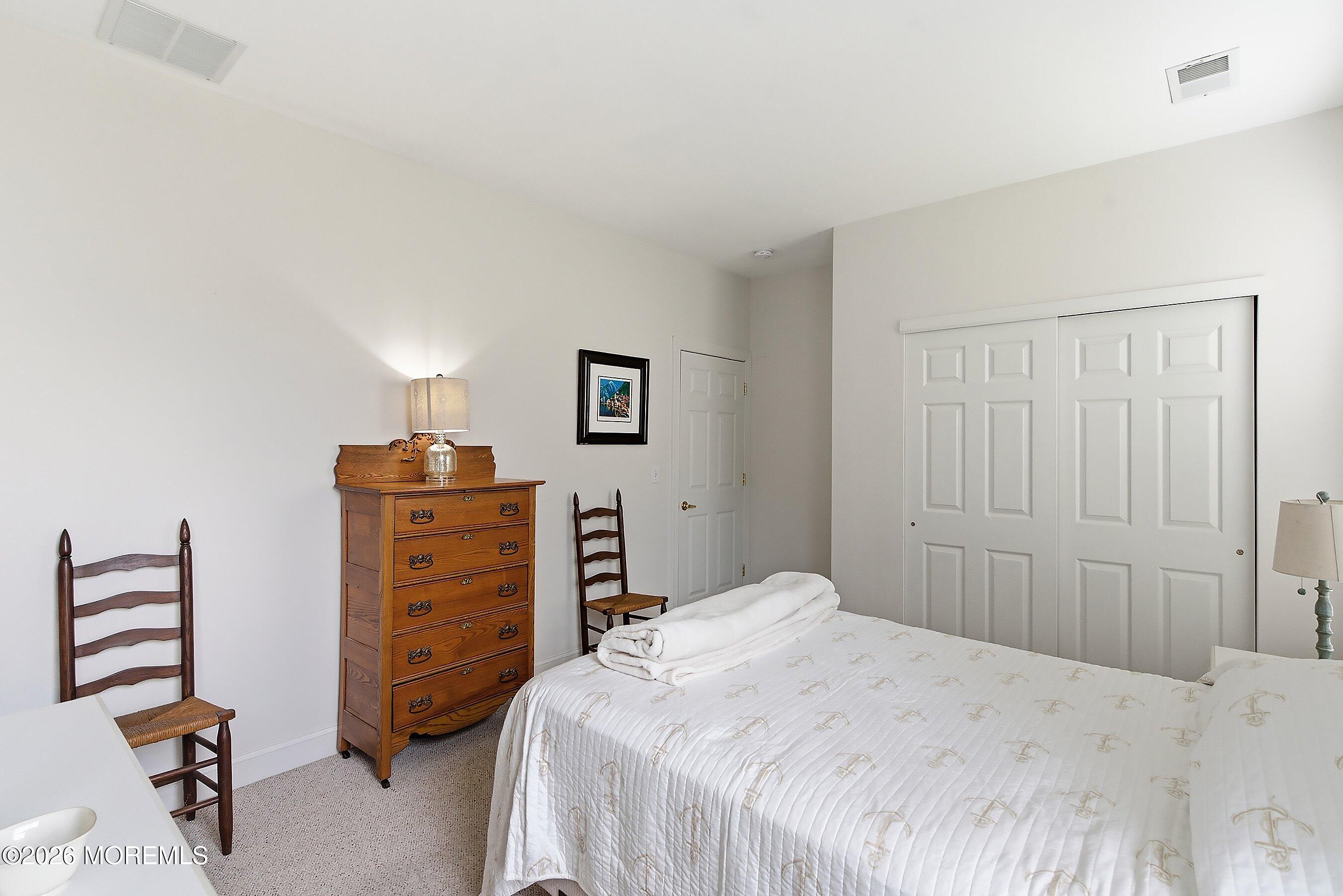 65 Mission Way Barnegat, NJ 08005 - Photo 16 of 51 a bedroom with a bed and a dresser