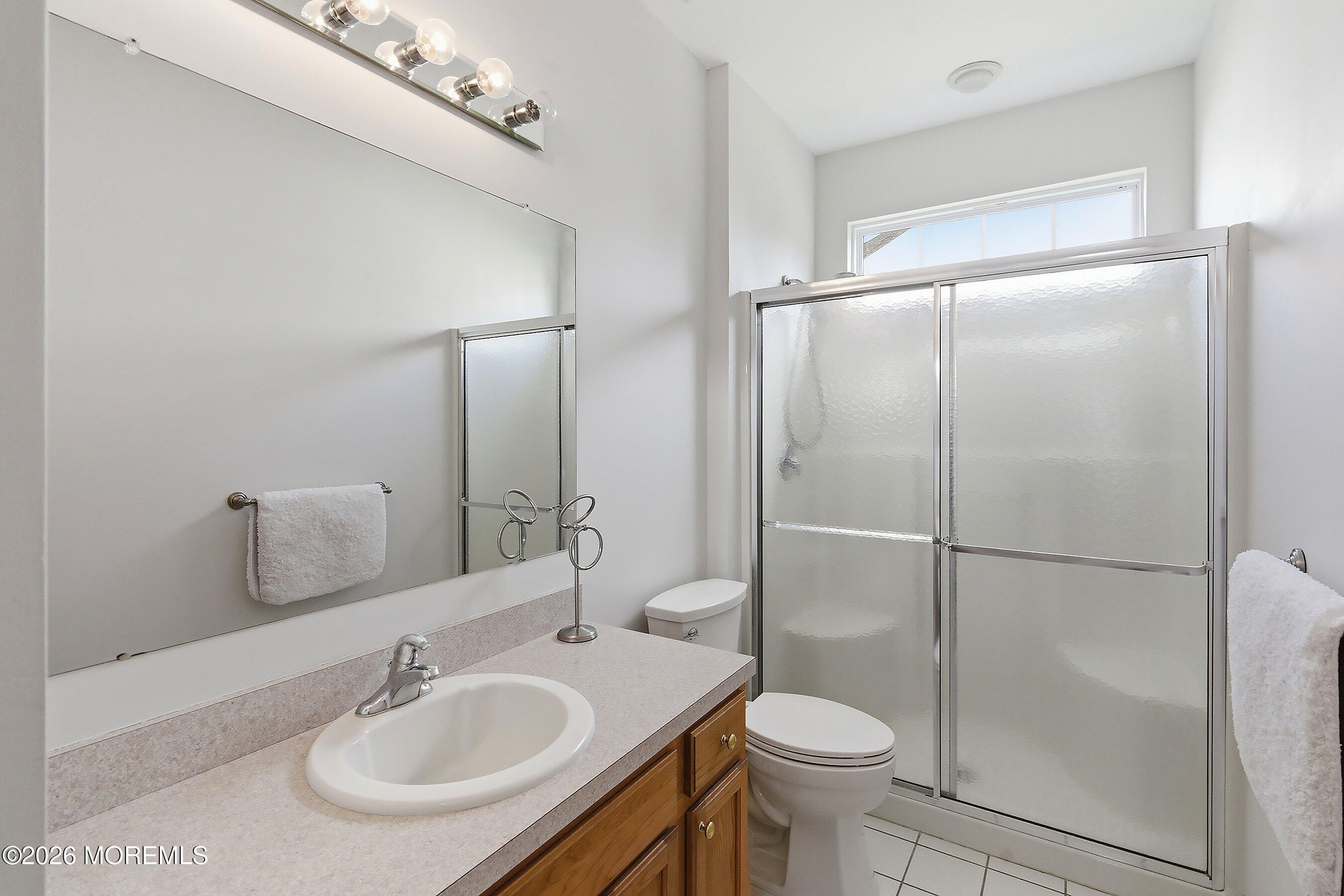 65 Mission Way Barnegat, NJ 08005 - Photo 20 of 51 a bathroom with a sink toilet and a mirror