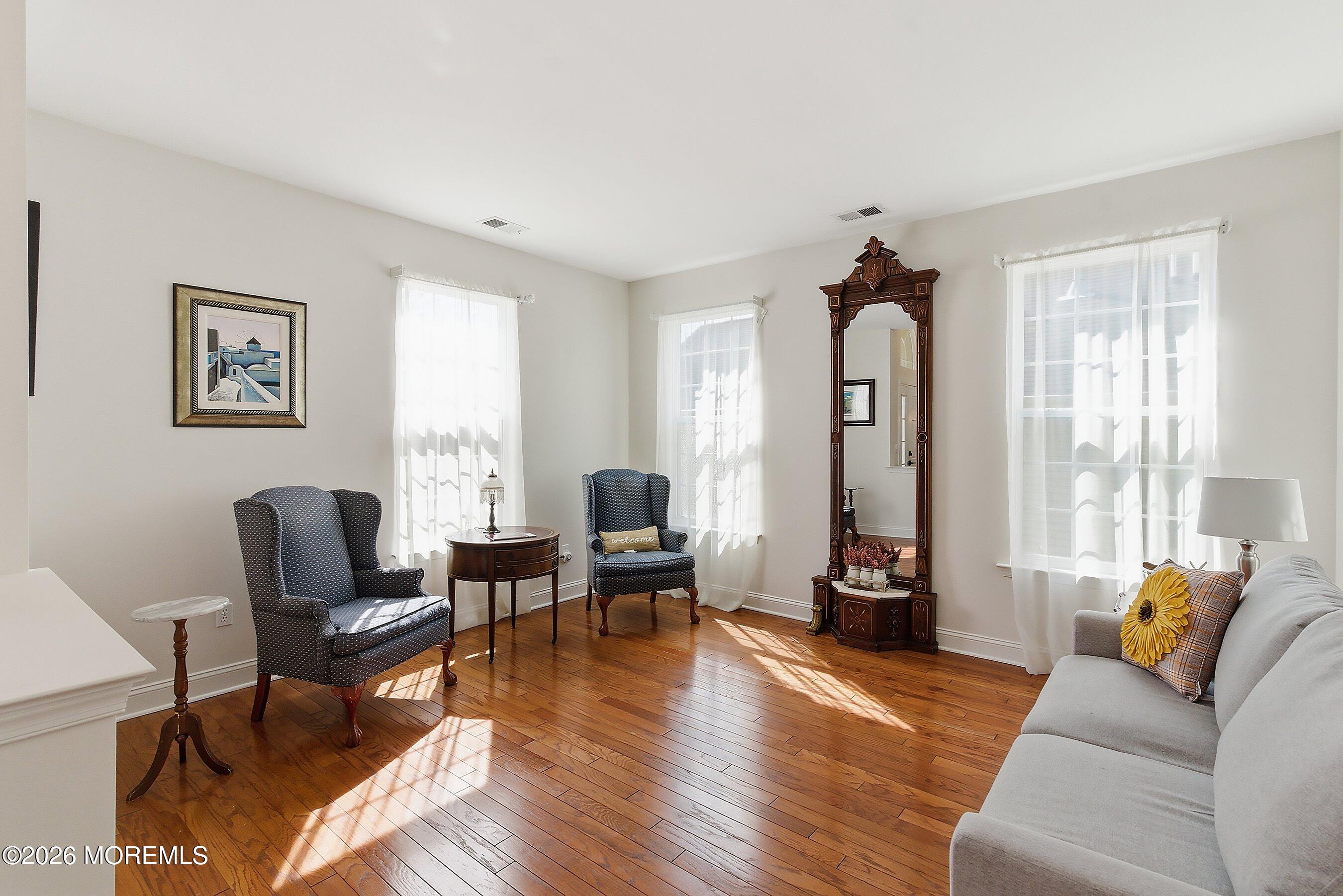 65 Mission Way Barnegat, NJ 08005 - Photo 3 of 51 a living room with furniture two wooden floor and a window