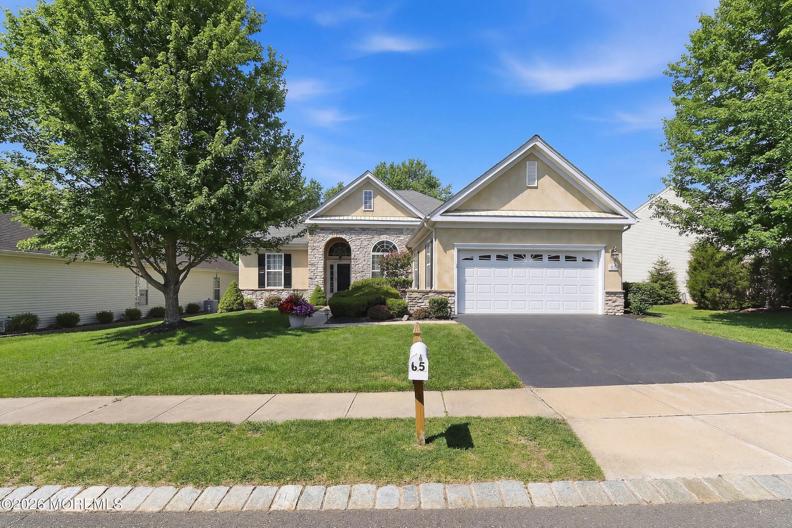 65 Mission Way Barnegat, NJ 08005 - Photo 37 of 51 a front view of a house with a yard and garage
