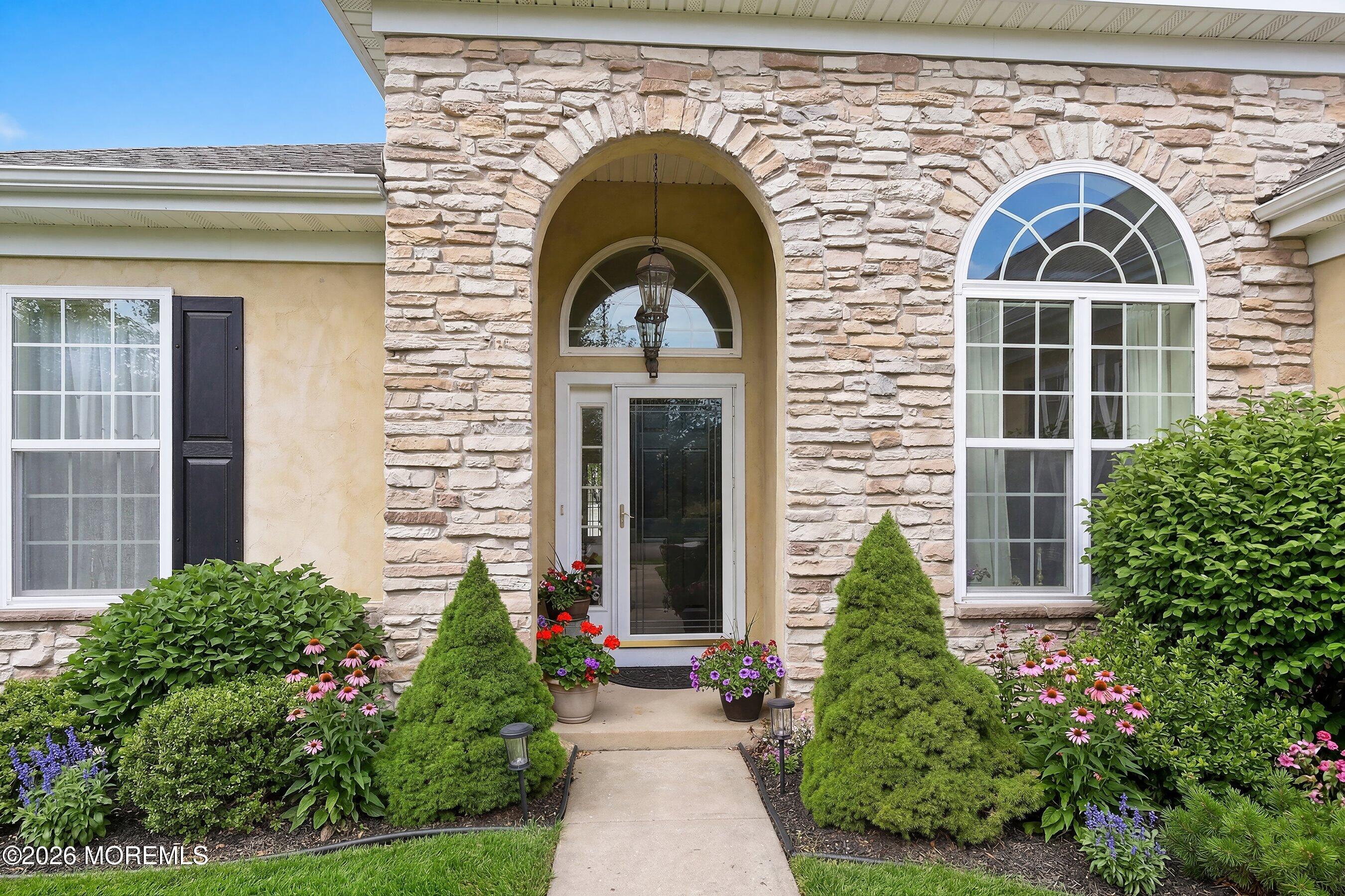 65 Mission Way Barnegat, NJ 08005 - Photo 38 of 51 a view of a brick house with potted plants
