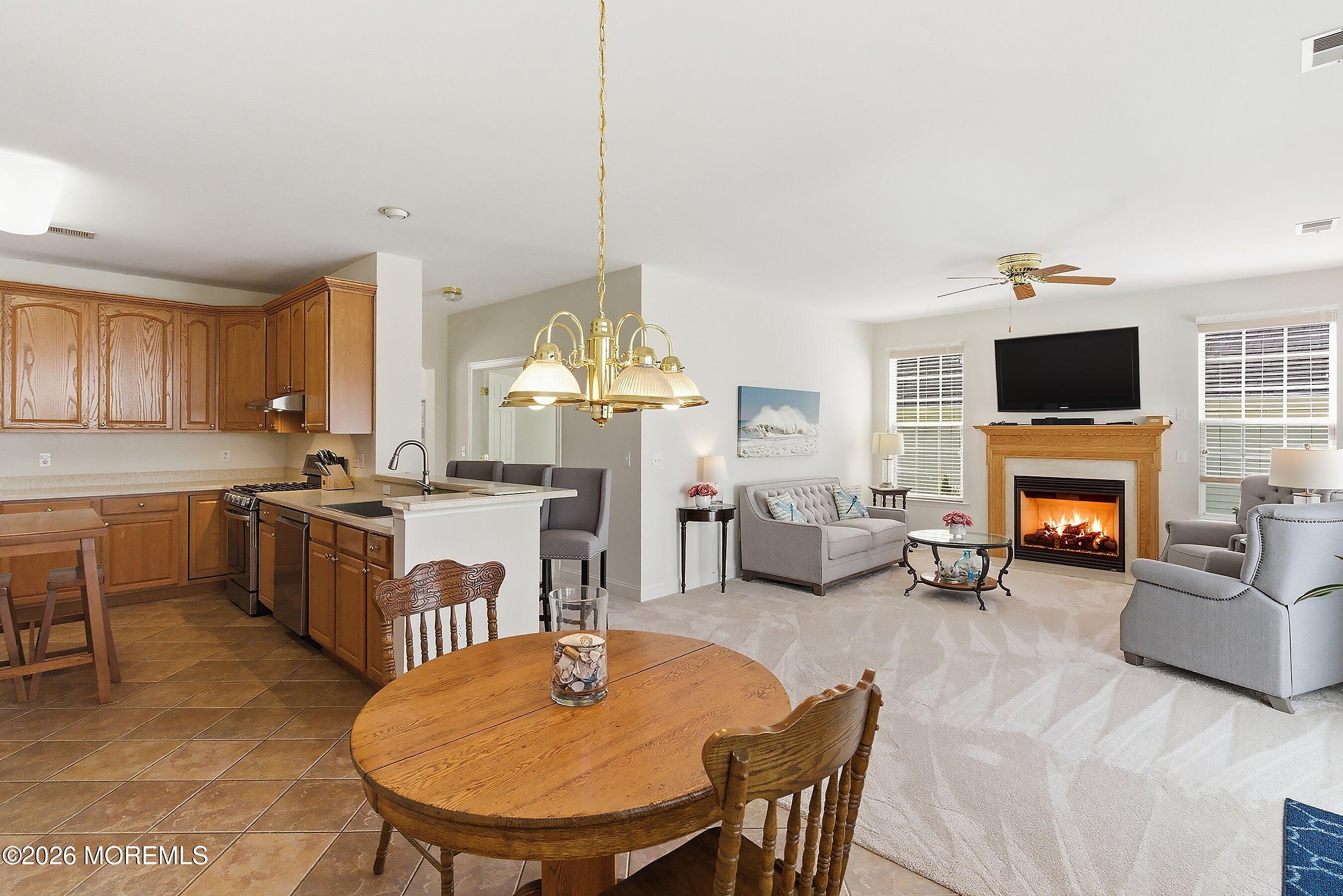 65 Mission Way Barnegat, NJ 08005 - Photo 6 of 51 a open kitchen with furniture a sink a stove and a refrigerator