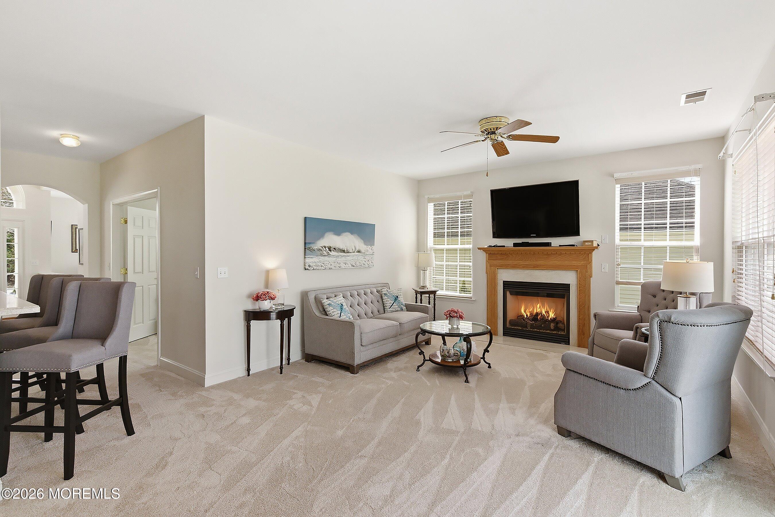 65 Mission Way Barnegat, NJ 08005 - Photo 7 of 51 a living room with furniture a fireplace and a flat screen tv