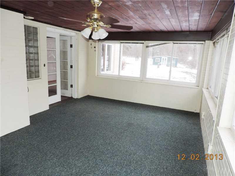655 Wallace Run Road Big Beaver, PA 15010 - Photo 10 of 24 Family Room. The 3 season room off the living room served as a first floor famliy room