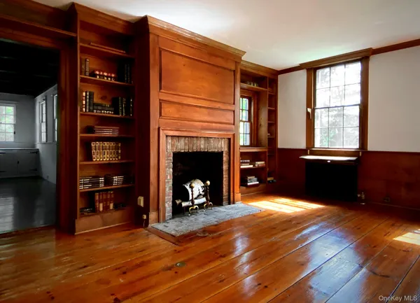 a view of a livingroom with furniture and staircase