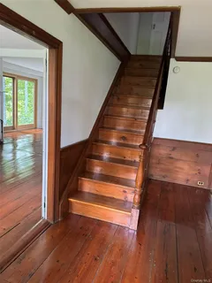 a view of entryway with wooden floor