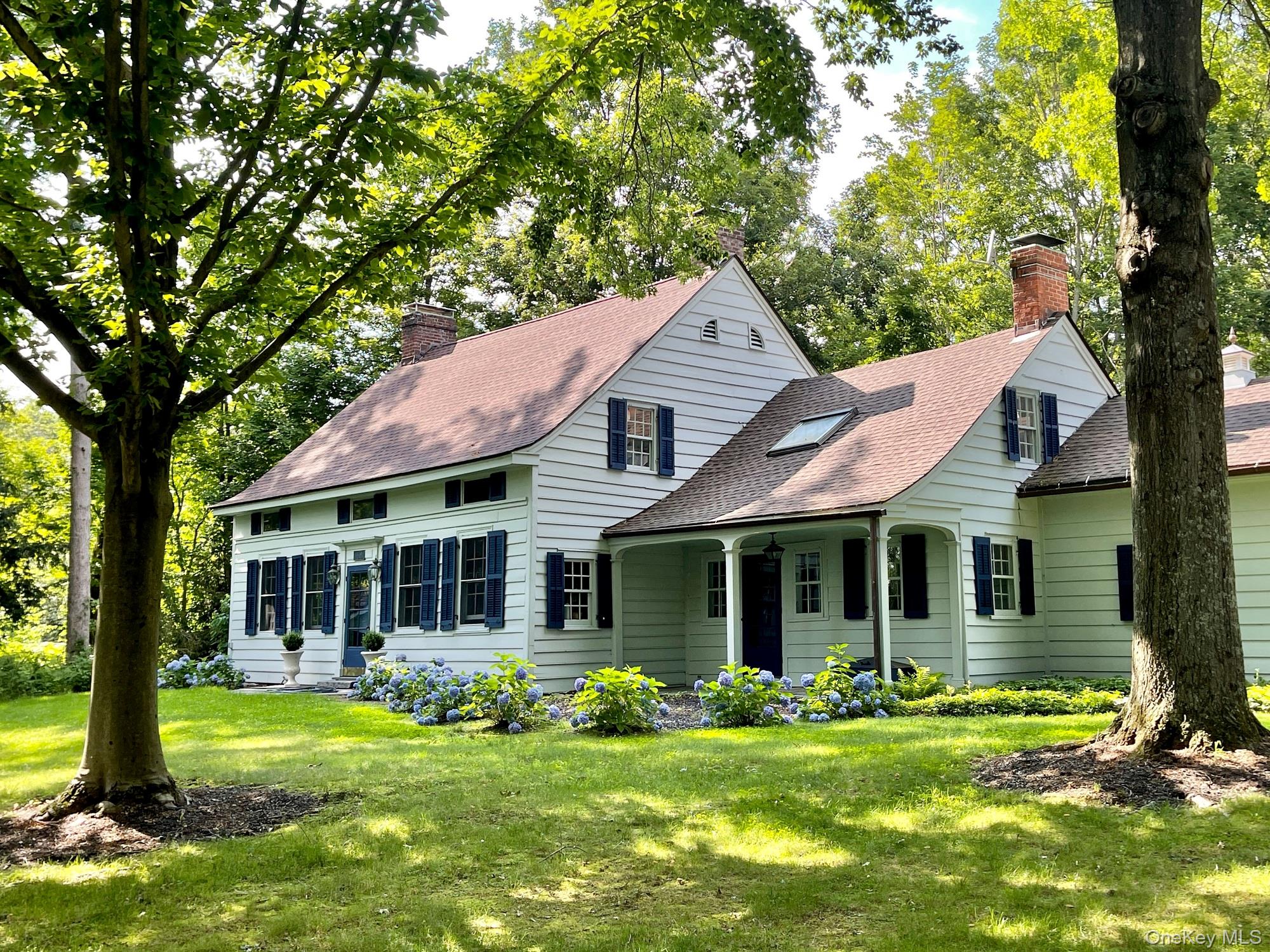 645 Tyrrel Road Millbrook, NY 12545 - Photo 35 of 39 a front view of a house with a garden and porch