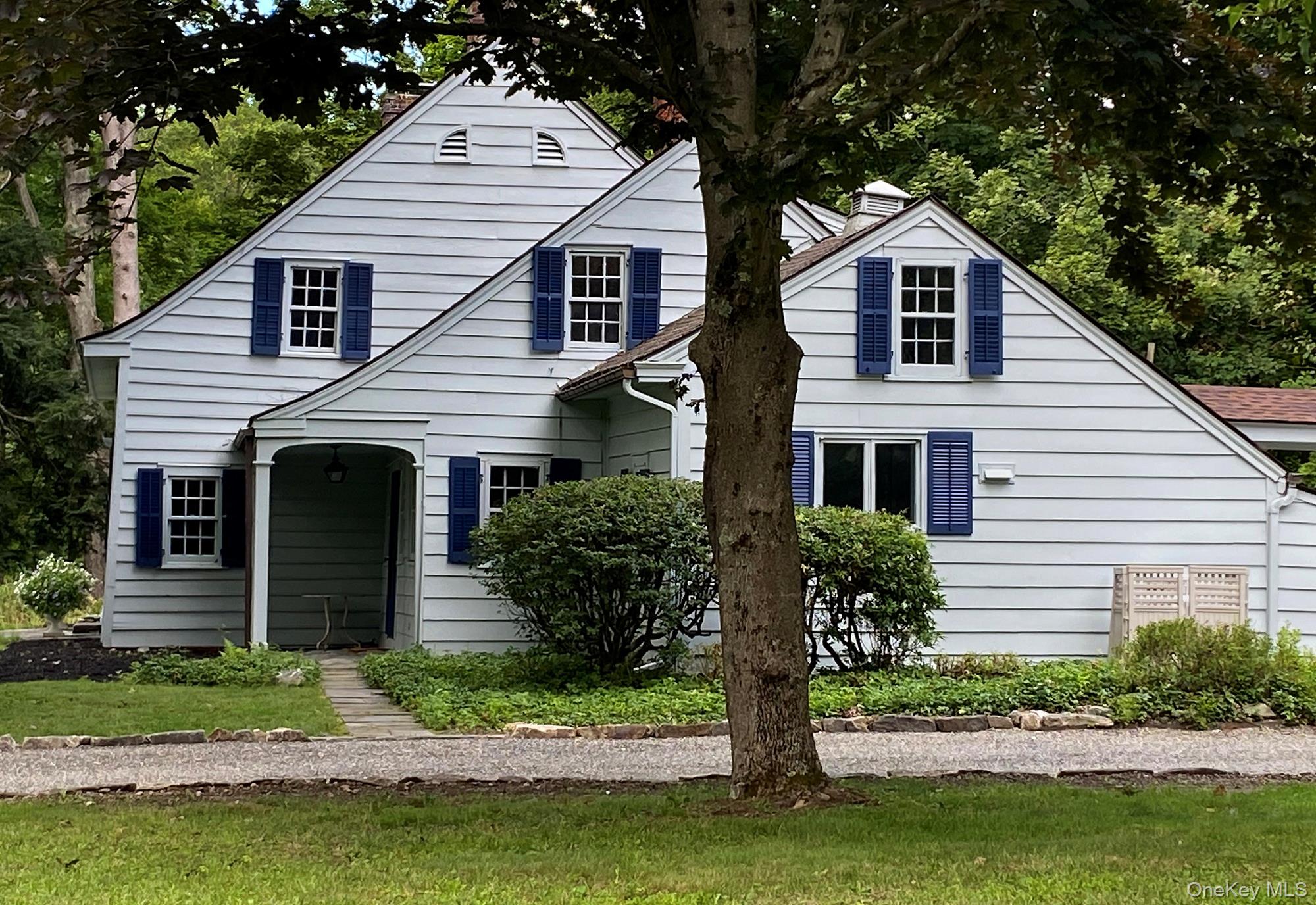 645 Tyrrel Road Millbrook, NY 12545 - Photo 4 of 39 a front view of a house with a yard and garage
