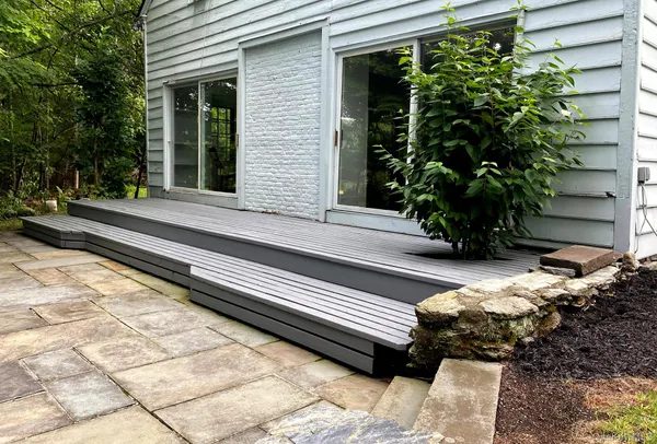 a side view of a house with a yard