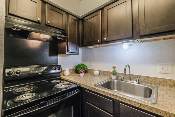 a kitchen with a stove and a sink