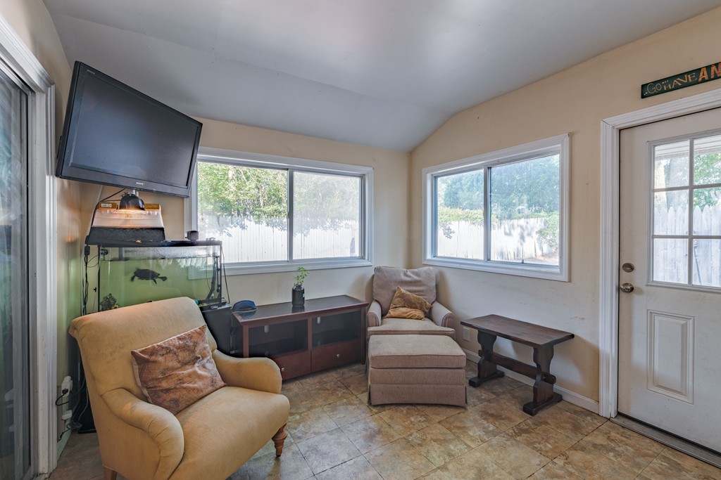 40 Christopher Road Brockton, MA 02302 - Photo 14 of 27 a living room with furniture and a floor to ceiling window