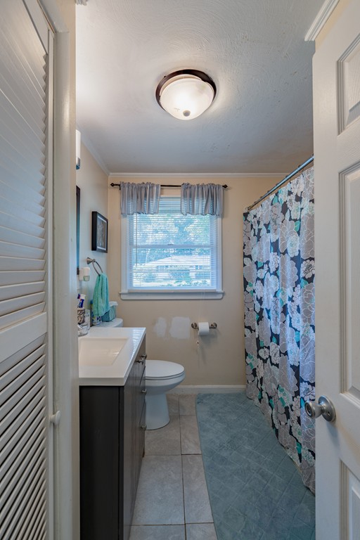 40 Christopher Road Brockton, MA 02302 - Photo 15 of 27 a bathroom with a sink and a mirror