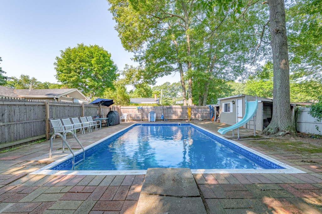 40 Christopher Road Brockton, MA 02302 - Photo 20 of 27 a view of a swimming pool with sitting area