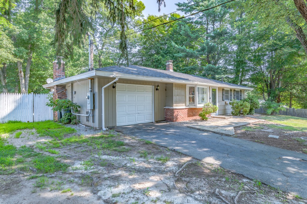 40 Christopher Road Brockton, MA 02302 - Photo 2 of 27 a view of a house with backyard and trees