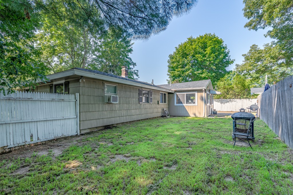 40 Christopher Road Brockton, MA 02302 - Photo 26 of 27 a backyard of a house with table and chairs
