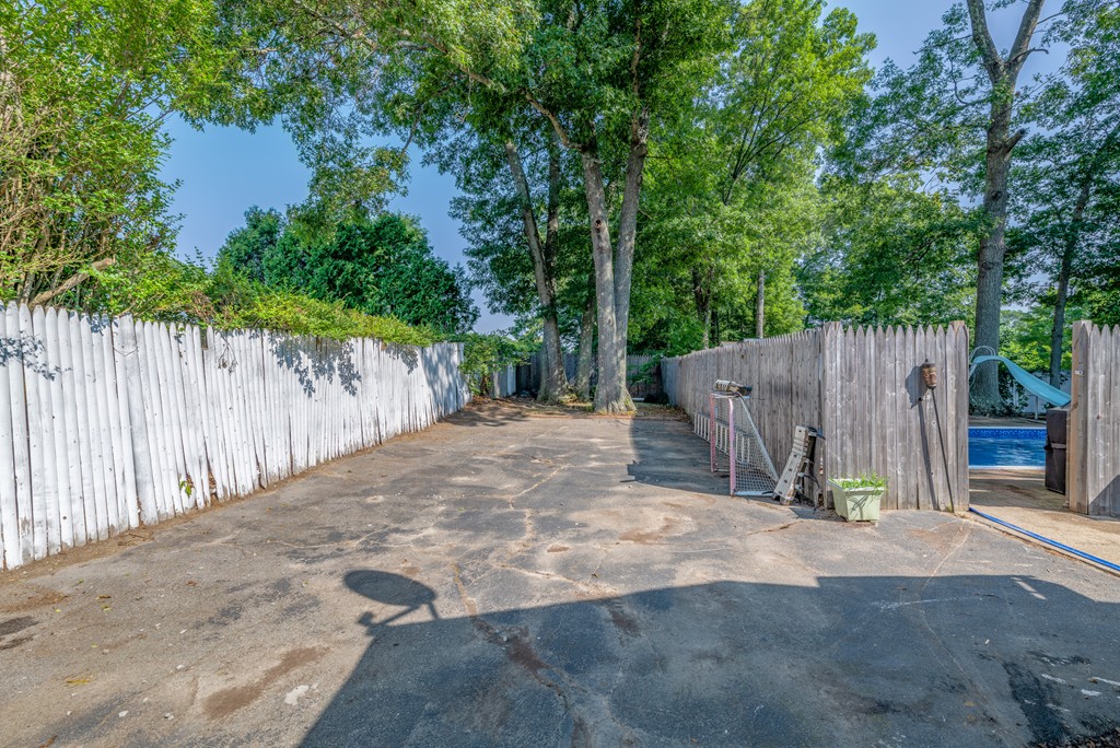 40 Christopher Road Brockton, MA 02302 - Photo 27 of 27 a view of backyard with small cabin and wooden fence