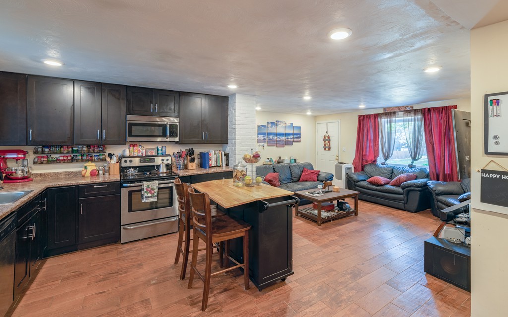 40 Christopher Road Brockton, MA 02302 - Photo 6 of 27 a kitchen with kitchen island granite countertop lots of counter top space and stainless steel appliances