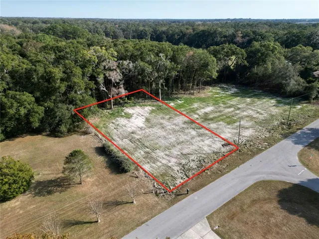 a view of a backyard with a barn