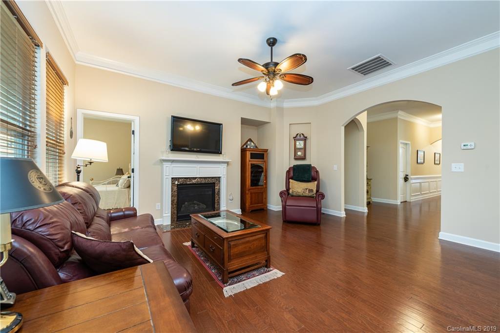 78008 Rillstone Drive Lancaster, SC 29720 - Photo 8 of 34 a living room with furniture fireplace and a flat screen tv
