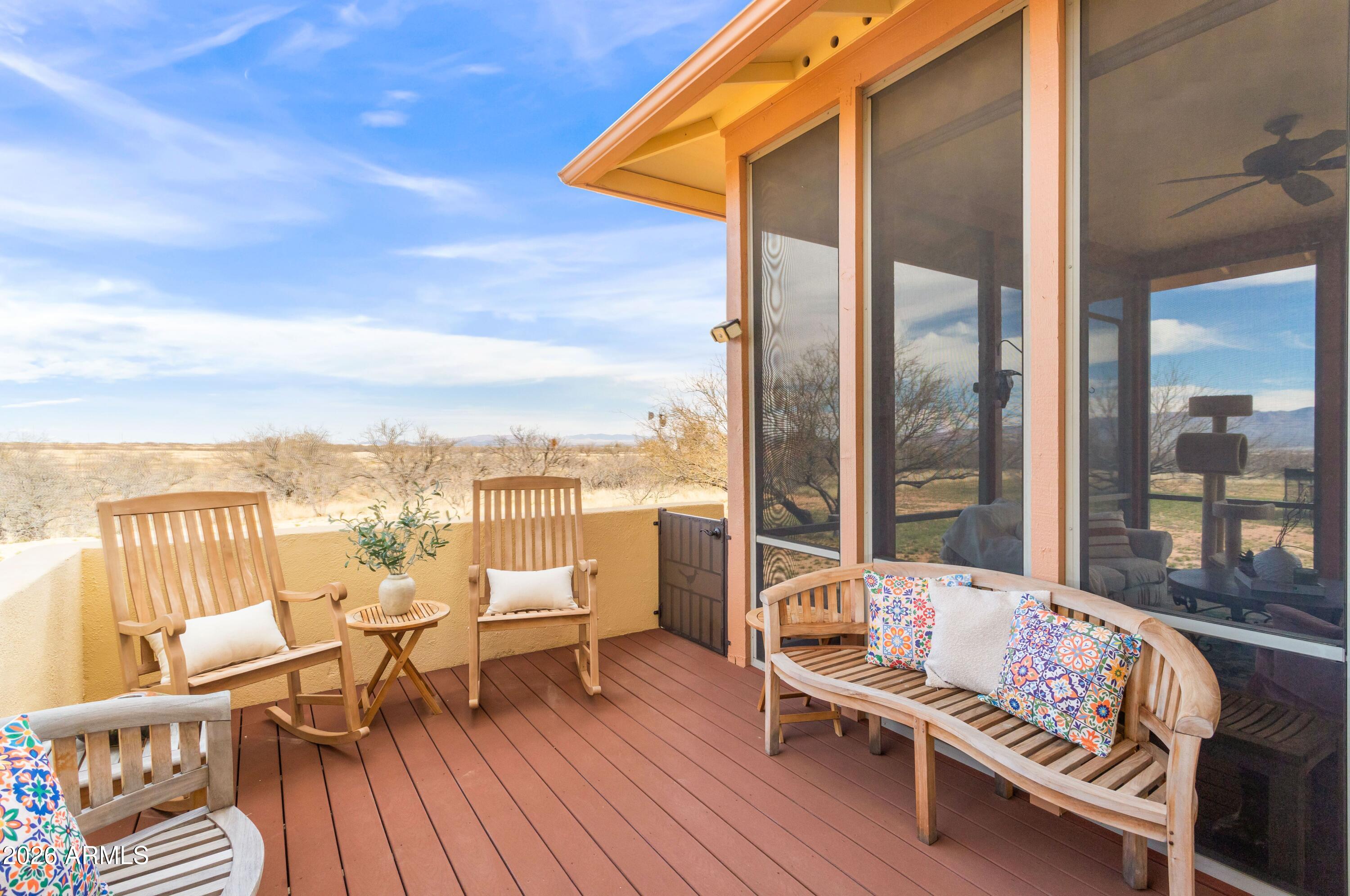 8541 South Almosta Ranch Road Hereford, AZ 85615 - Photo 14 of 53 a roof deck with lawn chairs and wooden floor