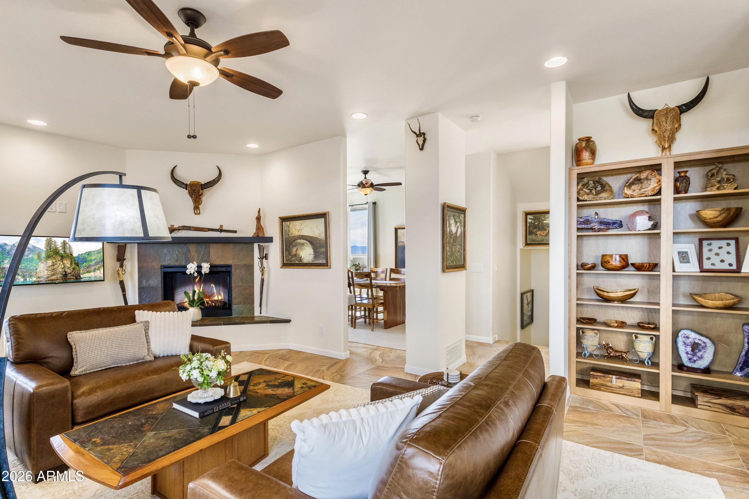 8541 South Almosta Ranch Road Hereford, AZ 85615 - Photo 17 of 53 a living room with furniture a ceiling fan and a rug