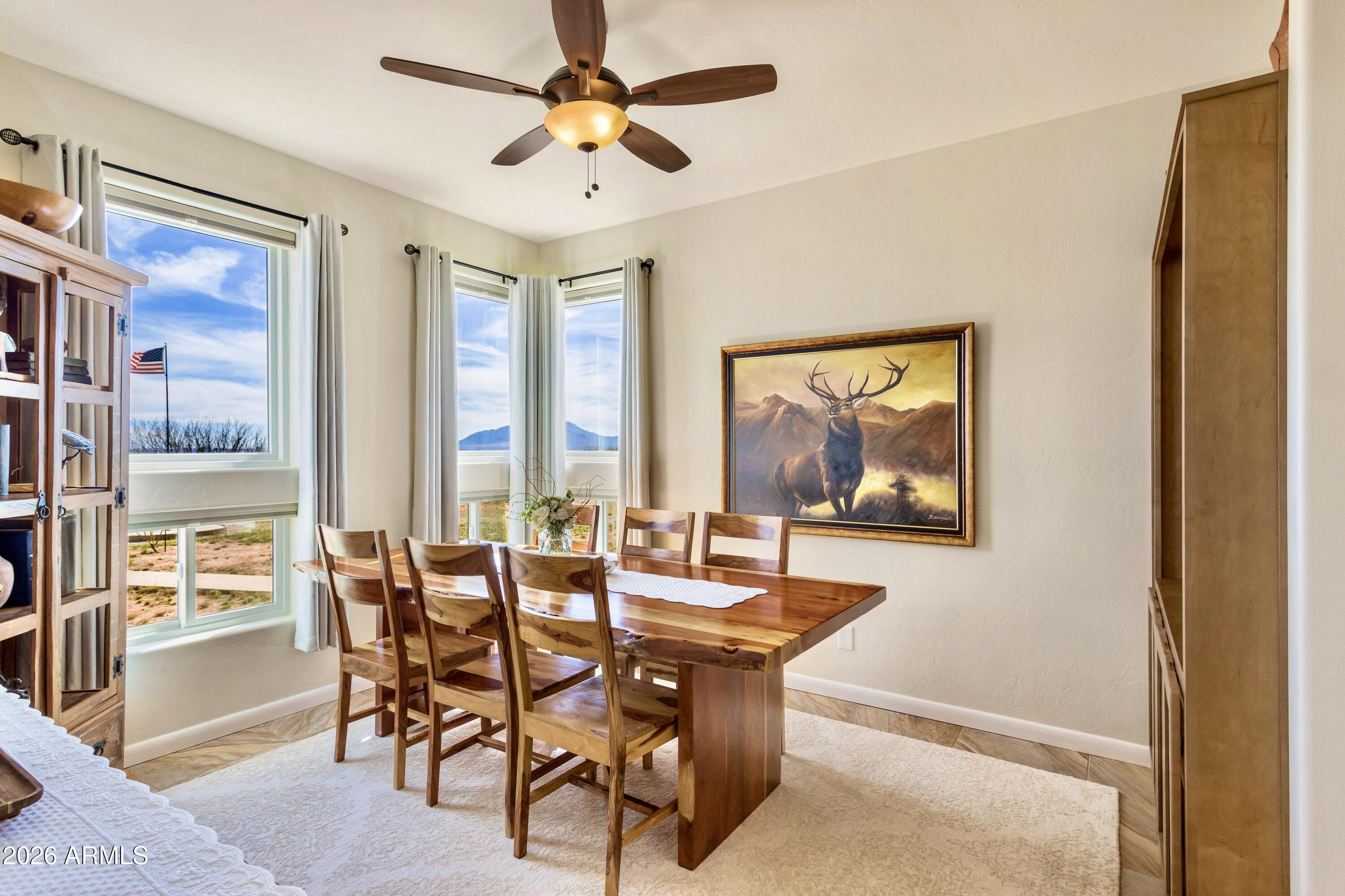 8541 South Almosta Ranch Road Hereford, AZ 85615 - Photo 20 of 53 a view of a dining room with furniture window and outside view