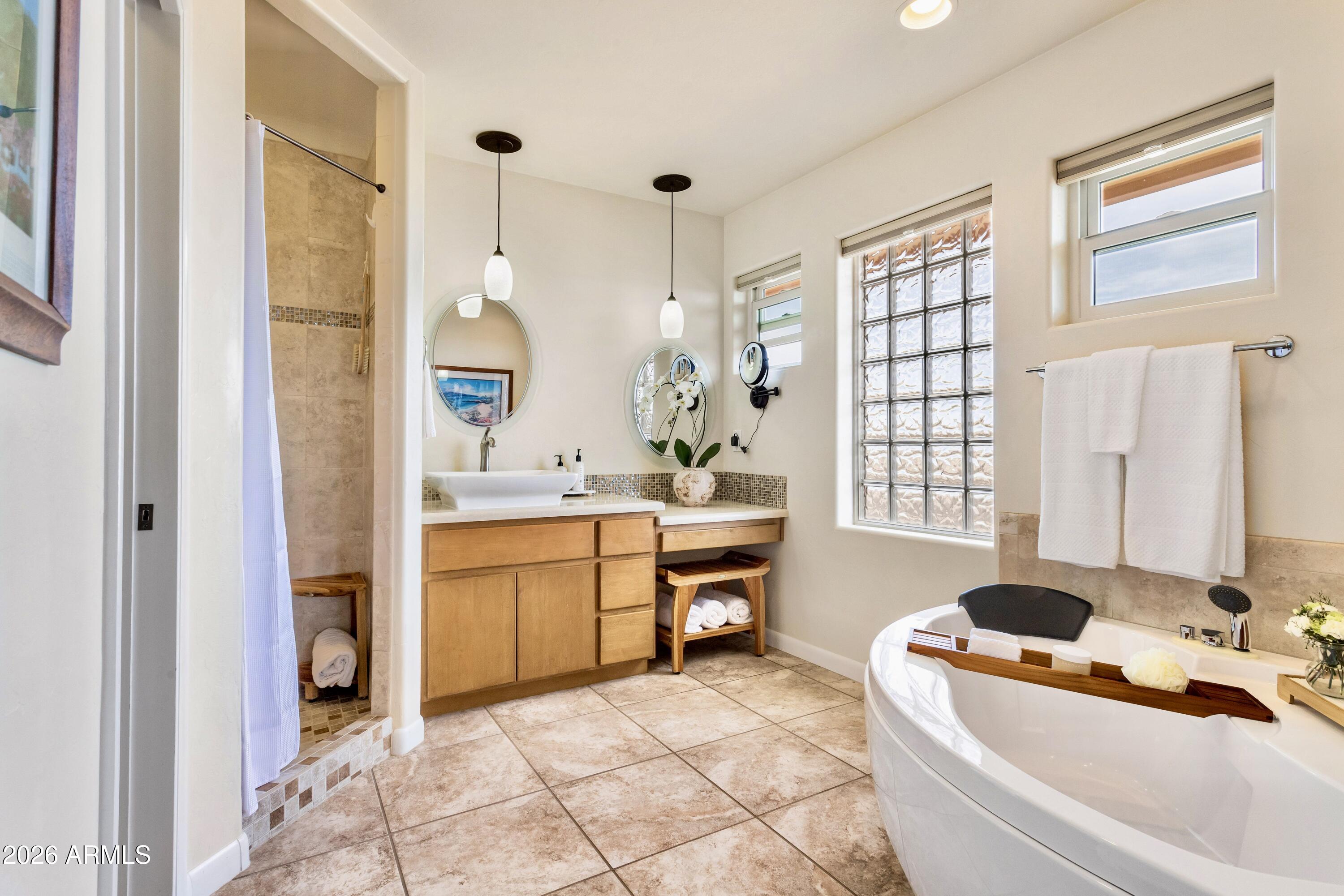 8541 South Almosta Ranch Road Hereford, AZ 85615 - Photo 28 of 53 a bathroom with a tub sink and mirror