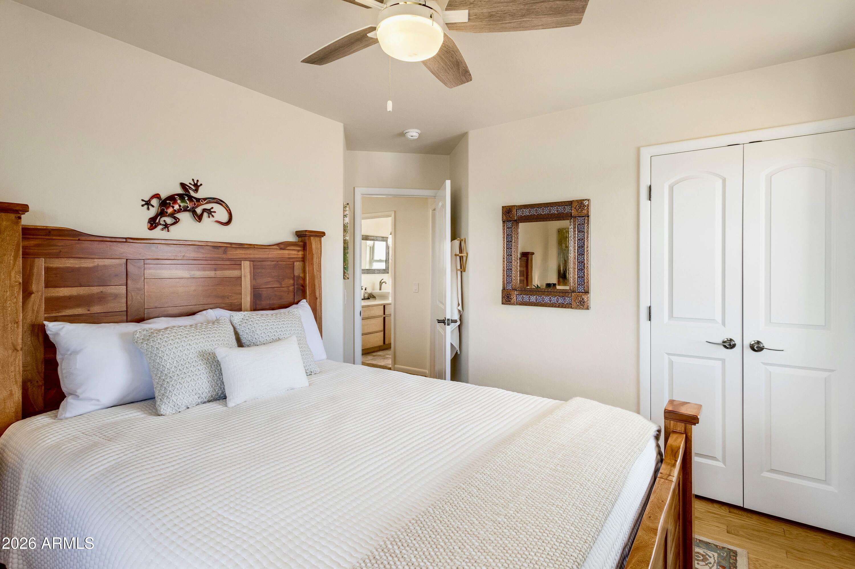 8541 South Almosta Ranch Road Hereford, AZ 85615 - Photo 35 of 53 a bedroom with a bed and a chandelier