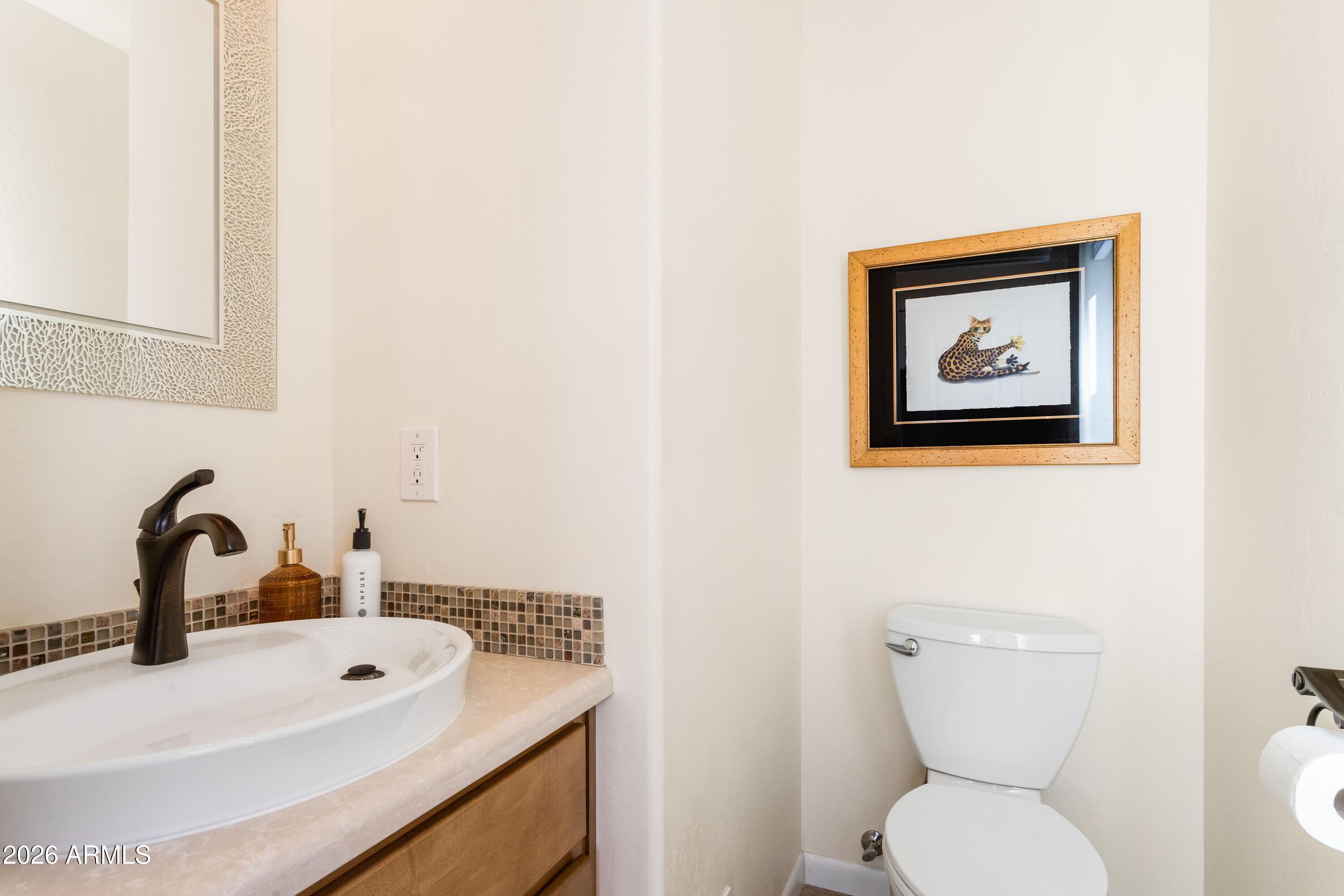 8541 South Almosta Ranch Road Hereford, AZ 85615 - Photo 39 of 53 a bathroom with a toilet and a sink