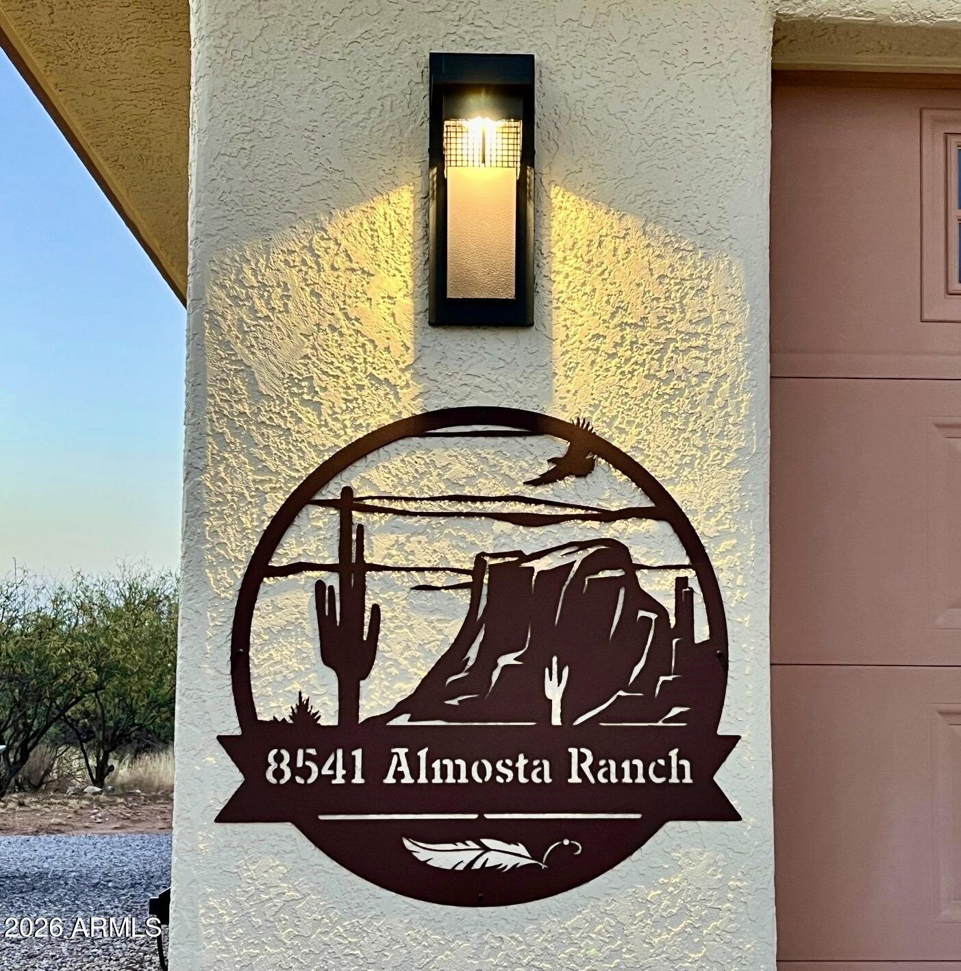 8541 South Almosta Ranch Road Hereford, AZ 85615 - Photo 49 of 53 a view of a wooden door with a sign