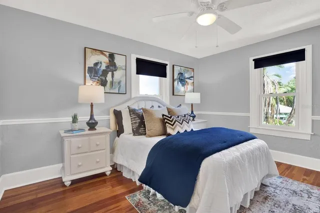 a bedroom with a large bed and a window