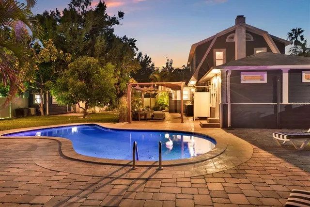 a view of swimming pool with lounge chair