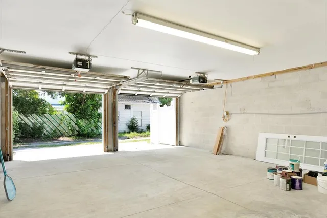 a view of a livingroom with furniture and floor to ceiling window