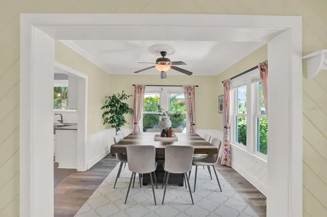 a view of a dining room with furniture window and outside view