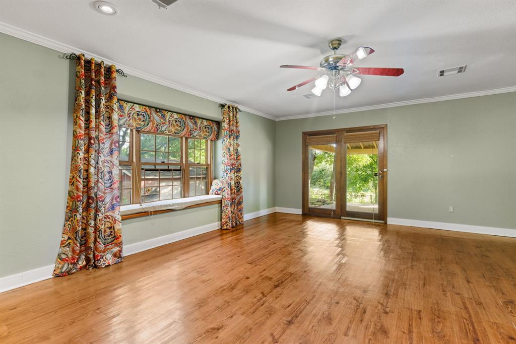 13539 Chapel Road Lorena, TX 76655 - Photo 12 of 37 Wood-finish flooring with light green walls and white trim