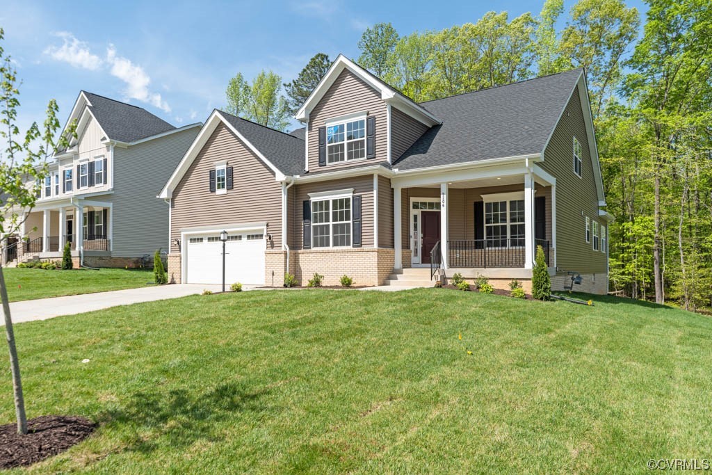 9206 Moldova Road Chesterfield, VA 23832 - Photo 3 of 40 a front view of a house with a yard