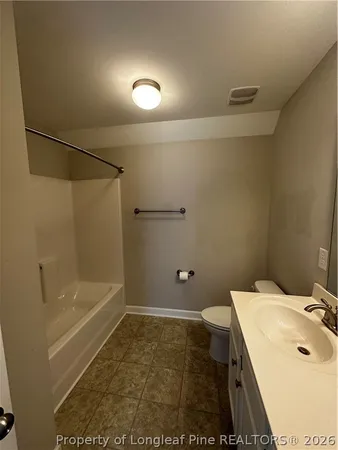 a bathroom with a sink and a shower