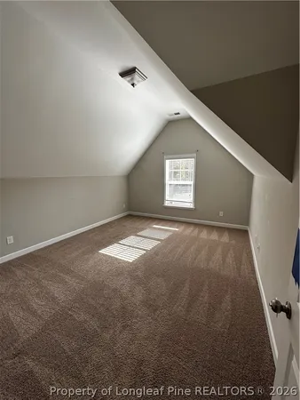 a view of empty room with windows