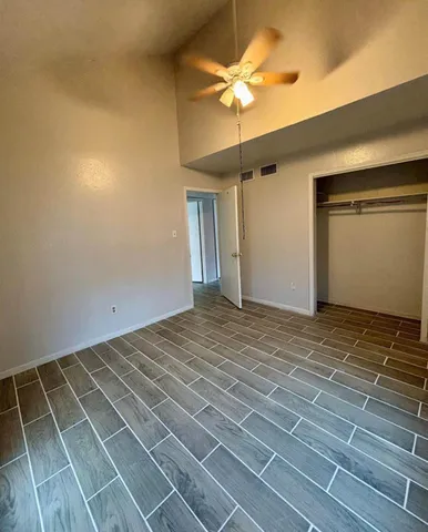 en empty room with a fan and fan