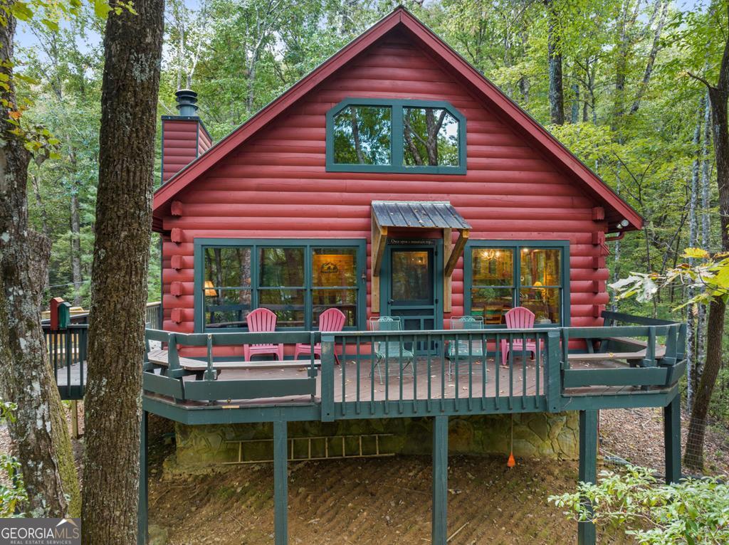 a view of a chairs and table in a balcony