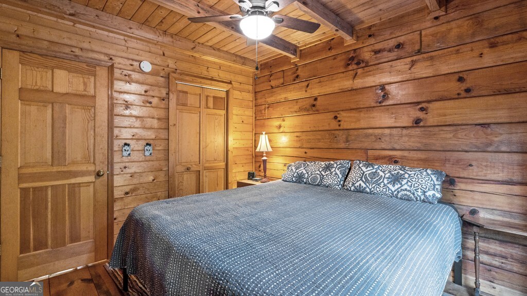390 Butler Creek Road, Unit 10 Cherry Log, GA 30522 - Photo 11 of 27 a bedroom with a bed and a closet