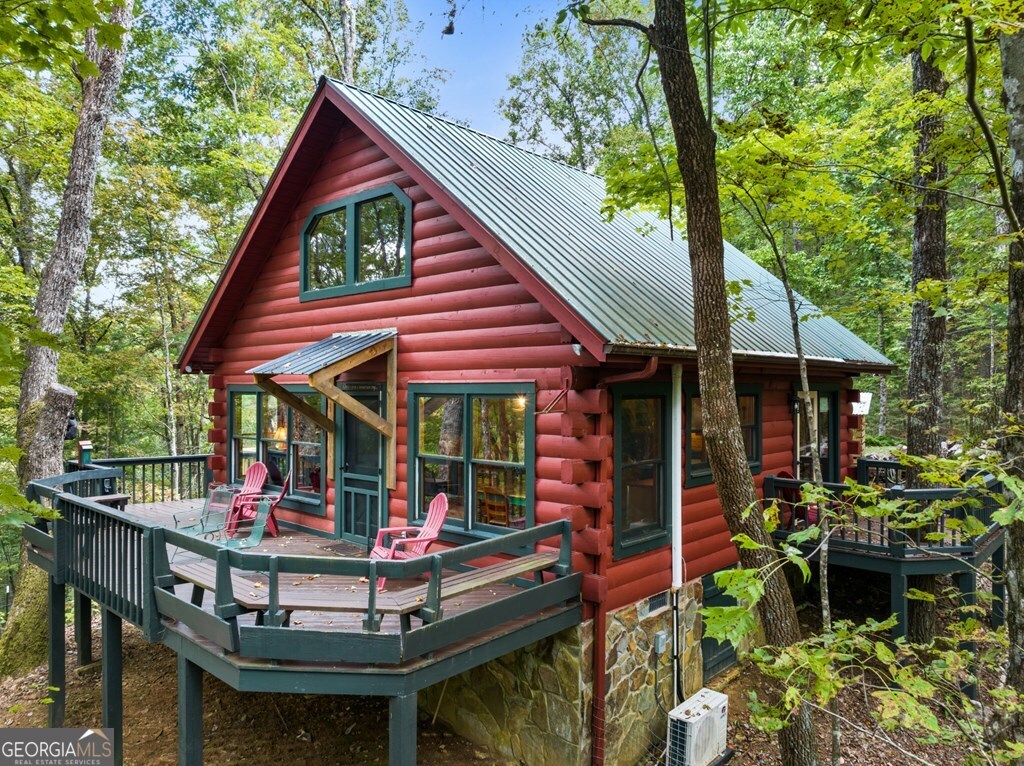 390 Butler Creek Road, Unit 10 Cherry Log, GA 30522 - Photo 19 of 27 a view of an outdoor sitting area with furniture