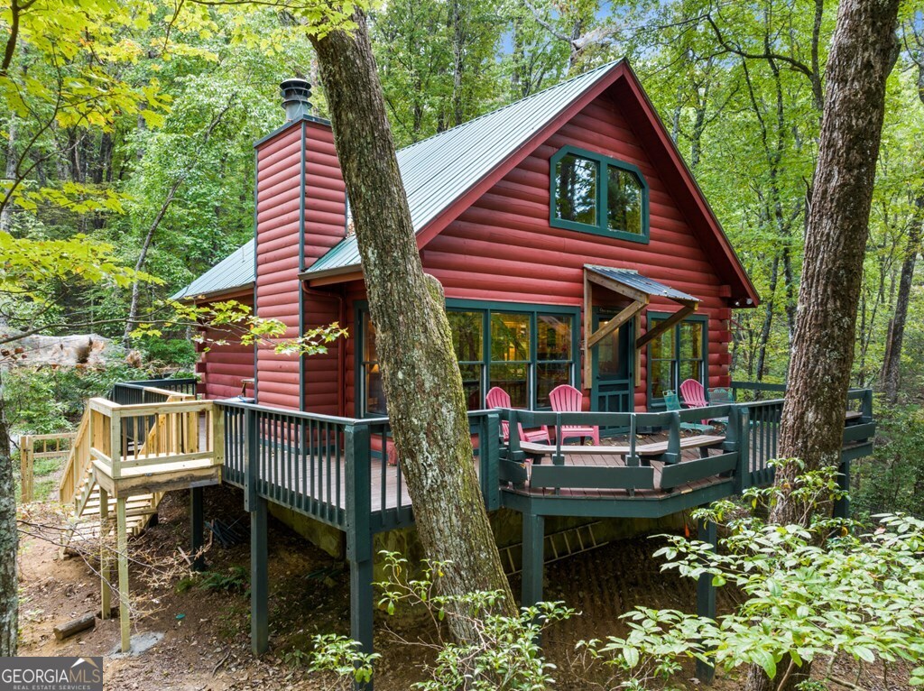 390 Butler Creek Road, Unit 10 Cherry Log, GA 30522 - Photo 22 of 27 a view of an outdoor sitting area with brick walls